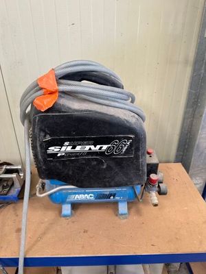 an image of a small air compressor on a table