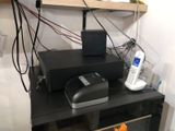 an image of a cell phone sitting on top of a shelf