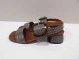 a close up of a pair of sandals on a white surface