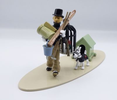 a figurine of a man with skis and a dog on a surfboard