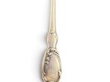 a silver spoon with a spoon handle on a white surface
