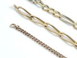three different types of bracelets on a white surface