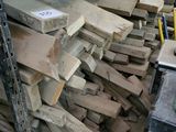 many pieces of wood stacked on top of each other