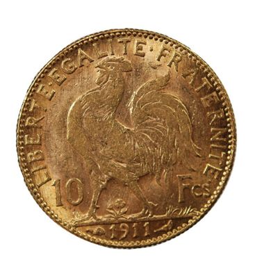 Gros plan sur une pièce d'or ornée d'un coq