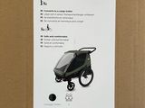 a close up of a box with a baby stroller in it