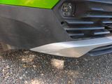 a close up of a car ' s front bumper and grille