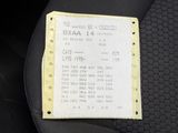a receipt sitting on the seat of a car