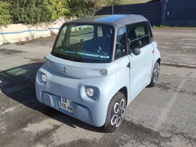 a small car that is parked in a parking lot