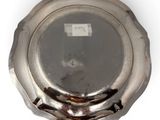 an antique silver plate with a silver lid on a white background