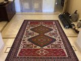 a rug on the floor in the hallway of a house