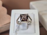 a ring that is sitting in a box on a table