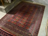 a rug on the floor in the corner of a room