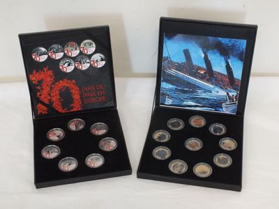 two boxes of silver coins with a picture of a ship in the background