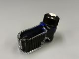 a bottle of ink sitting on top of a table