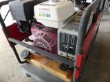 a small cart with a small engine on top of it