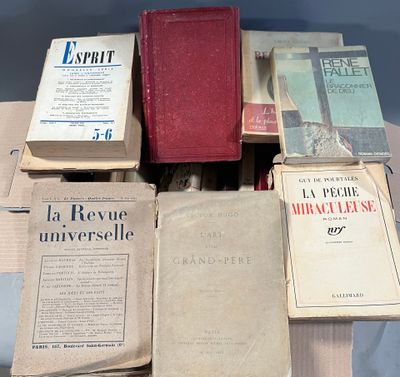 several books are stacked on top of each other on a table