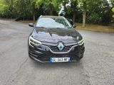 the front view of a black car parked on the side of the road