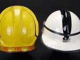 two hard hats that are sitting next to each other
