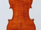 an old violin with a wooden back and a long neck