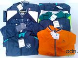 a lot of jackets that are sitting on a table