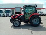 a tractor that is parked in a parking lot