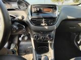 a dashboard of a car with a steering wheel and dashboard controls