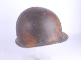 a helmet on a stand on a white surface