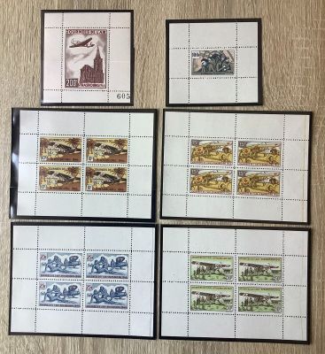 four different stamps are displayed on a wall with a picture of a woman