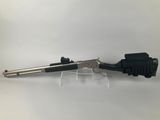 a gun that is sitting on top of a table