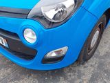a blue car that is parked in a parking lot