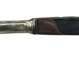 a knife that is sitting on top of a table