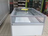 a glass display case in the middle of a store