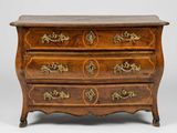 an antique chest of drawers with brass handles and a marble top
