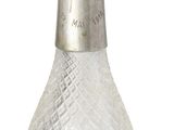 an image of a glass bottle with a bird on top