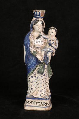 an image of a statue of a woman holding a child