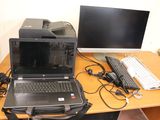a laptop computer sitting on top of a desk next to a computer monitor