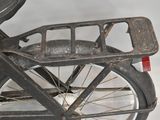 an old bicycle with a basket on the back