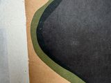 a picture of a piece of paper with a black and green design on it