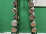 a pair of dumbs on a metal rack in a room