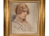 portrait of a young woman in a gold frame