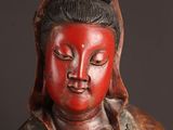 statue of a woman with a red face and black hair