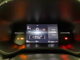 the dashboard of a car with a digital display on it