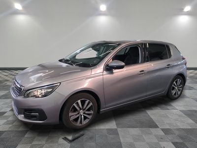 a picture of a silver car parked in a showroom