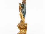 a statue of a woman holding a baby in her arms