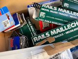 many items in a box that are sitting on the floor