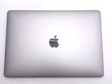 an apple logo on the back of an apple laptop