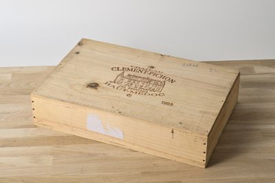 a wooden box that is sitting on a wooden floor