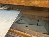 a close up of a piece of wood that is missing