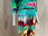 a mannequin wearing a colorful tie dye suit on a mannequin mannequin mannequin mannequin mannequin mannequin manne