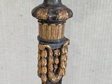 an image of a tall vase with a gold decoration on top of it